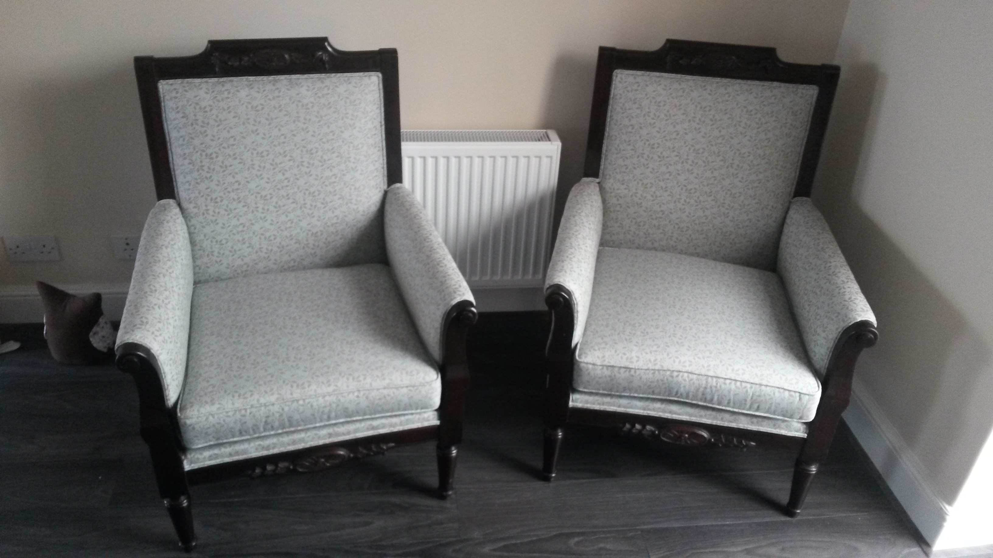Two armchairs upholstered with gray fabric